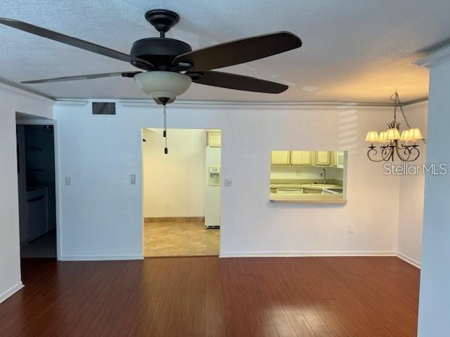 1261 Pine Ridge Circle West, Unit E2 Tarpon Springs, FL 34688 - Photo 7 of 16 a view of a livingroom with wooden floor