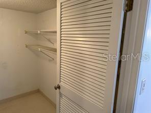 1261 Pine Ridge Circle West, Unit E2 Tarpon Springs, FL 34688 - Photo 10 of 16 a bathroom with a shower