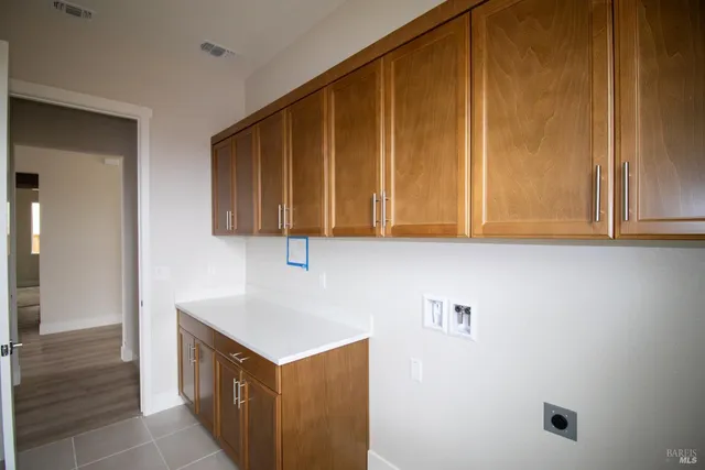 a open kitchen with granite countertop a stove top oven a sink and dishwasher with wooden floor