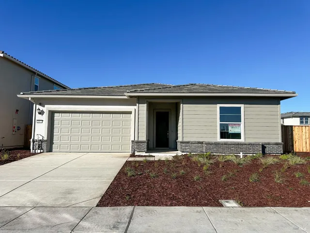 a view of kitchen with cabinets and wooden floor