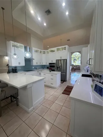 a large kitchen with cabinets