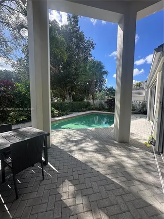 a view of backyard with trampoline