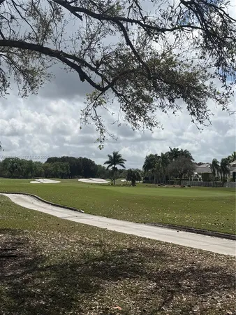 a view of a golf course with a lake