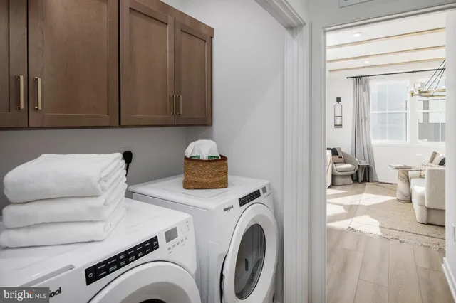 a view of livingroom with washer and dryer