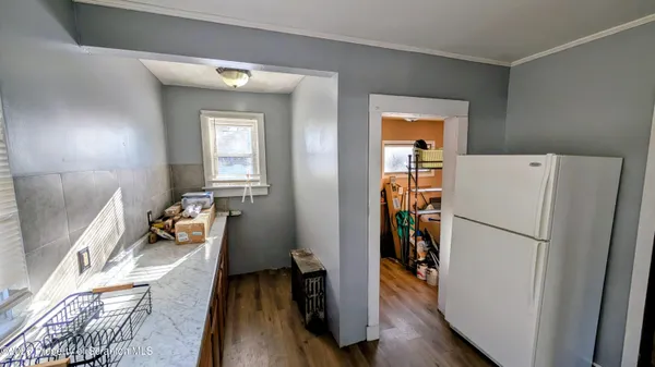 a kitchen with a sink stove top oven and cabinets