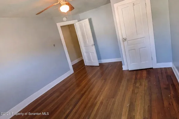 a view of an empty room with a window