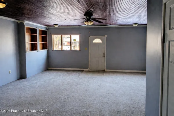 a view of an empty room with a window