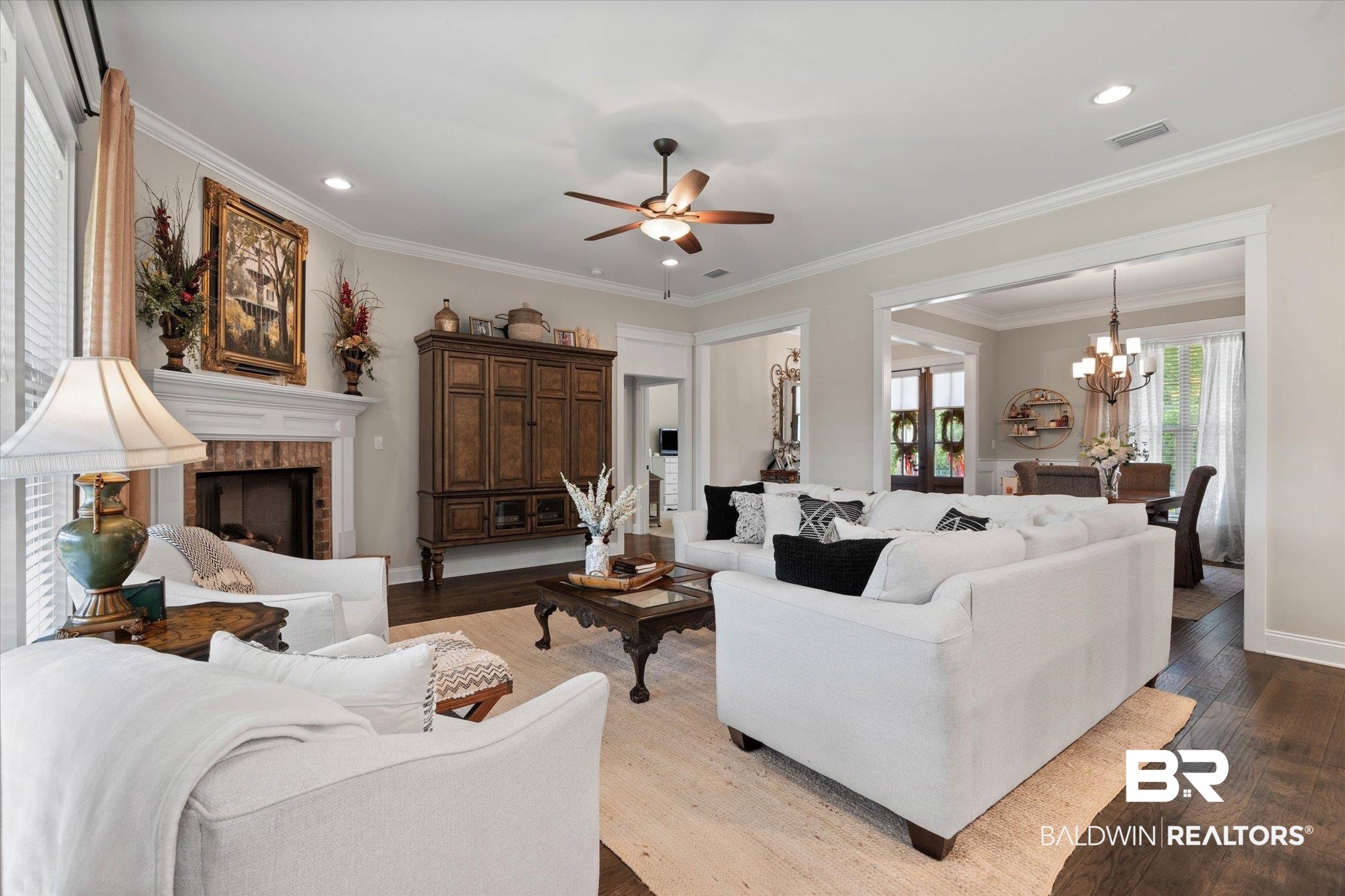 24821 Austin Road Daphne, AL 36526 - Photo 4 of 24 Living area featuring a chandelier, wood finished floors, ceiling fan, recessed lighting, and a fireplace