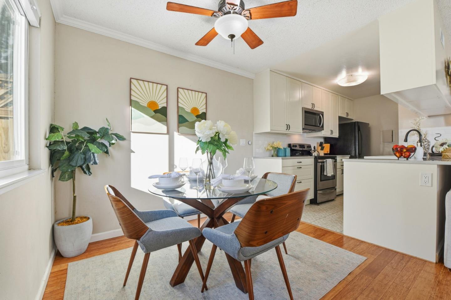 5701 Calmor Avenue, Unit 2 San Jose, CA 95123 - Photo 7 of 10 a dining room with furniture potted plants and wooden floor