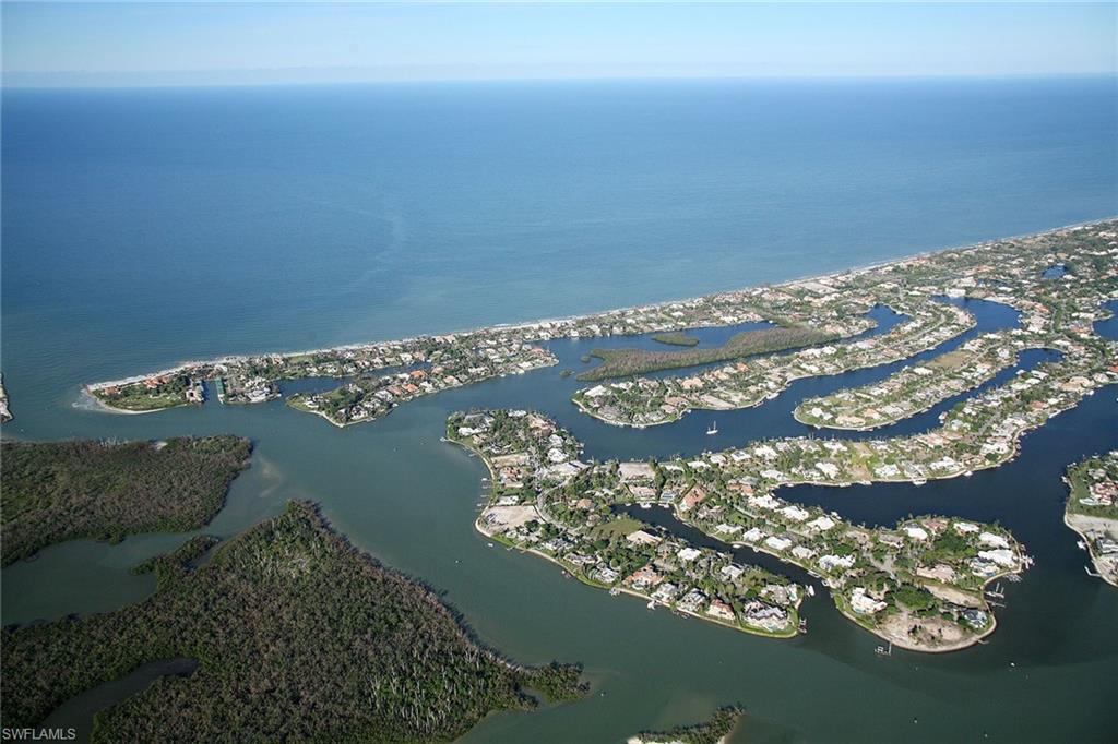12 Sabre Lane Naples, FL 34102 - Photo 11 of 17 a view of water from a balcony