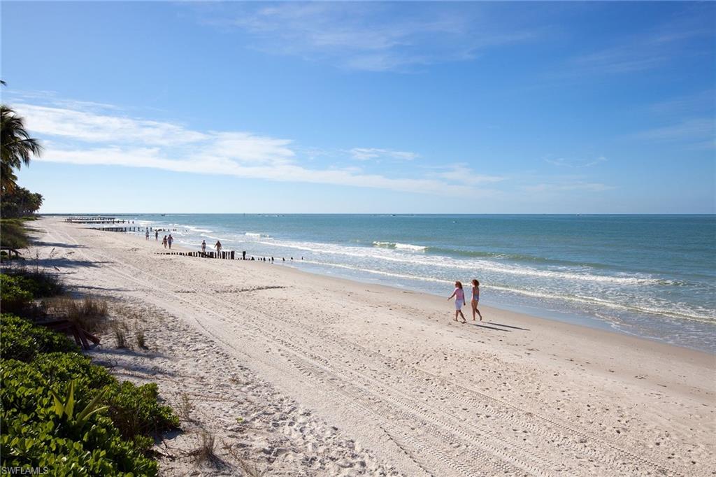12 Sabre Lane Naples, FL 34102 - Photo 17 of 17 a view of a lake with a beach