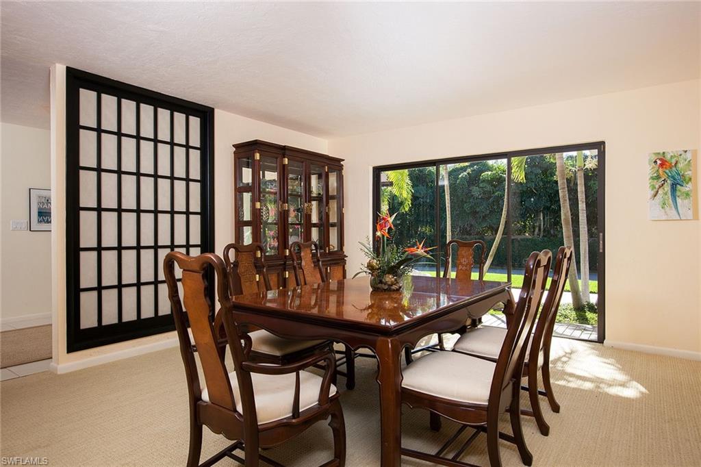 12 Sabre Lane Naples, FL 34102 - Photo 6 of 17 a view of a dining room with furniture and window