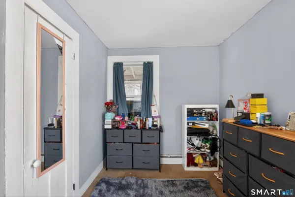 a room with furniture and wooden floor