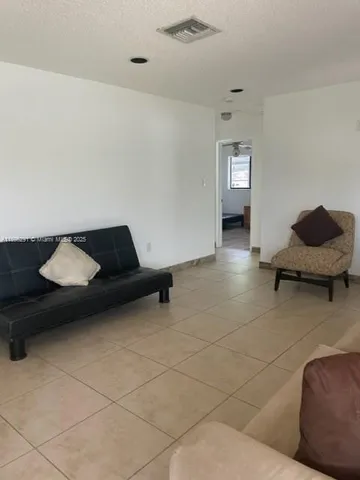 a living room with furniture and a couch