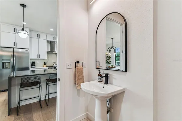 a view of a roof deck with table and chairs