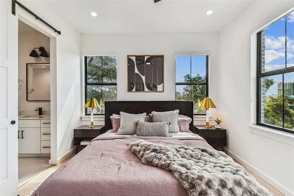 a bedroom with a bed and a walk in closet