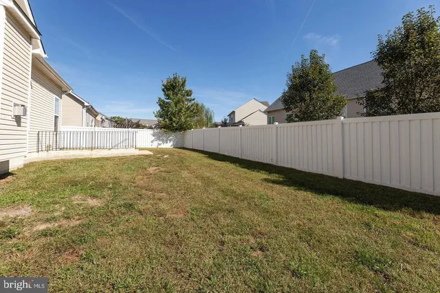 a view of a backyard of the house