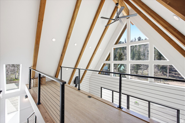 1833 Pine Loop Road Coalville, UT 84017 - Photo 11 of 26 Overlook balcony featuring a cable railing system, wood-finish flooring, and exposed timber ceiling beams