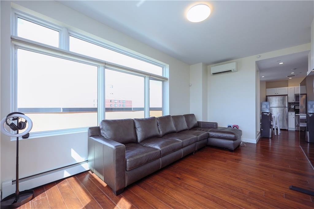 7819 Bay Parkway, Unit PH Brooklyn, NY 11214 - Photo 5 of 28 a living room with furniture and a large window