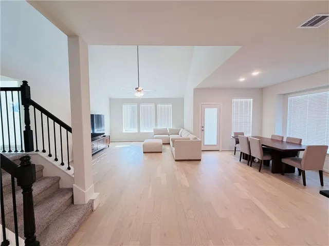 a living room with furniture and a table