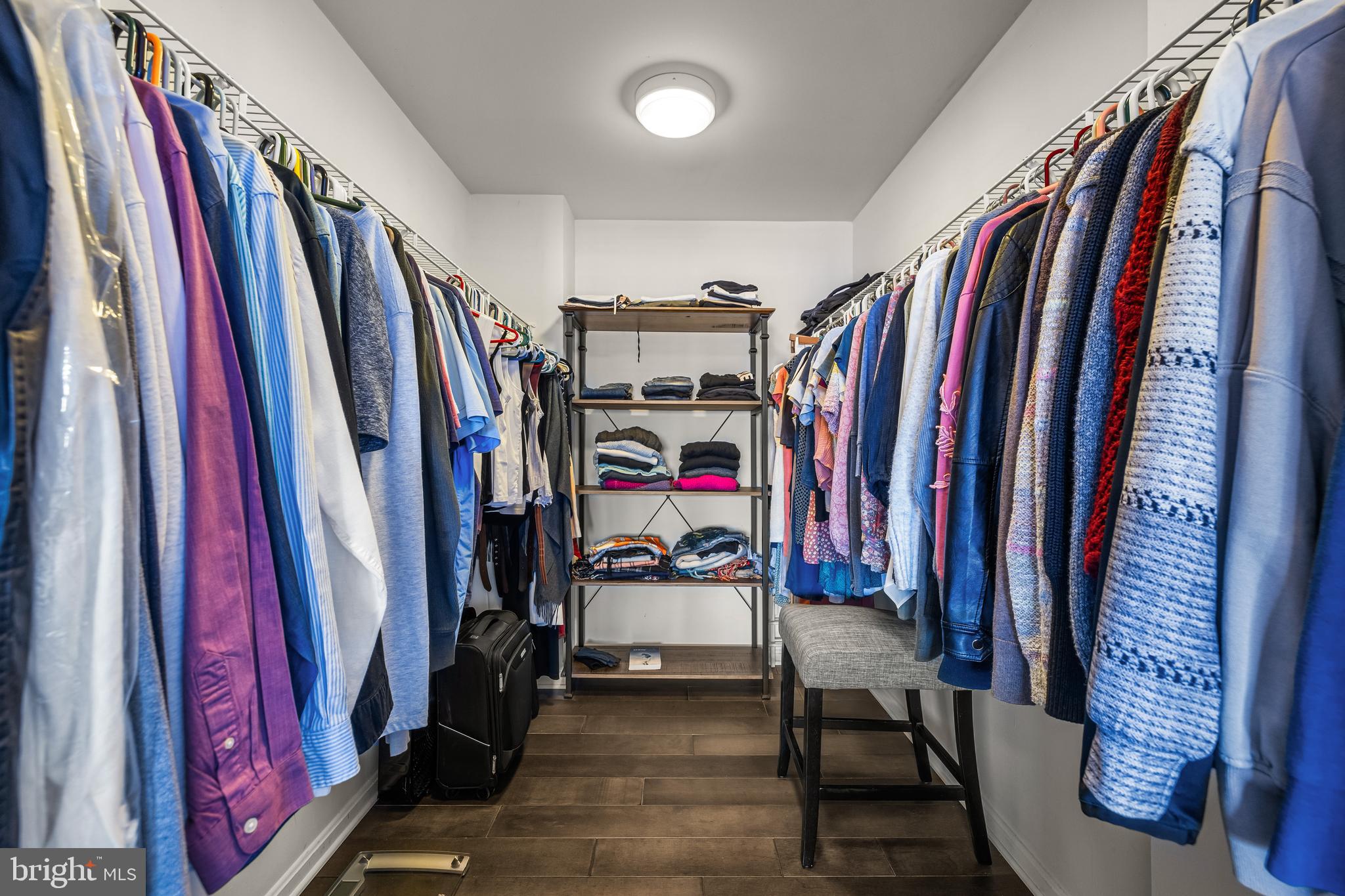 2702 Lighthouse Point East, Unit 720 Baltimore, MD 21224 - Photo 19 of 37 a view of walk in closet with clothes