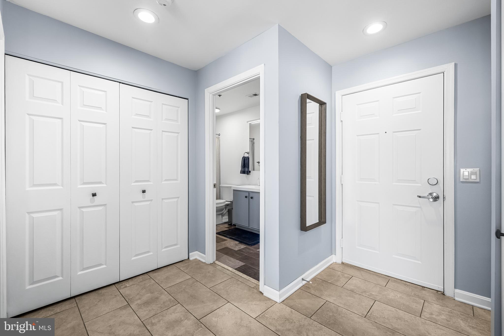 2702 Lighthouse Point East, Unit 720 Baltimore, MD 21224 - Photo 23 of 37 a view of a hallway with closet area