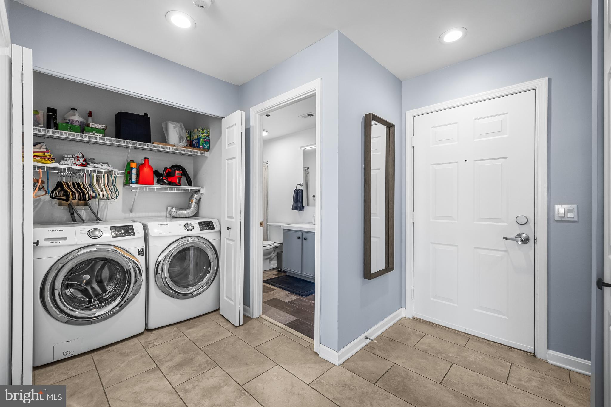 2702 Lighthouse Point East, Unit 720 Baltimore, MD 21224 - Photo 24 of 37 a utility room with dryer and washer