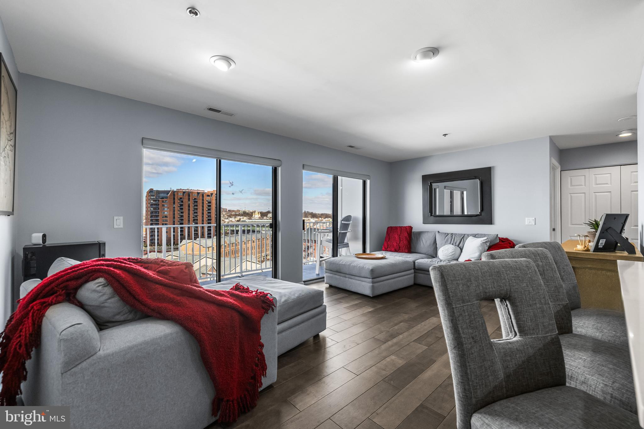 2702 Lighthouse Point East, Unit 720 Baltimore, MD 21224 - Photo 4 of 37 a bed room with a bed and a couch