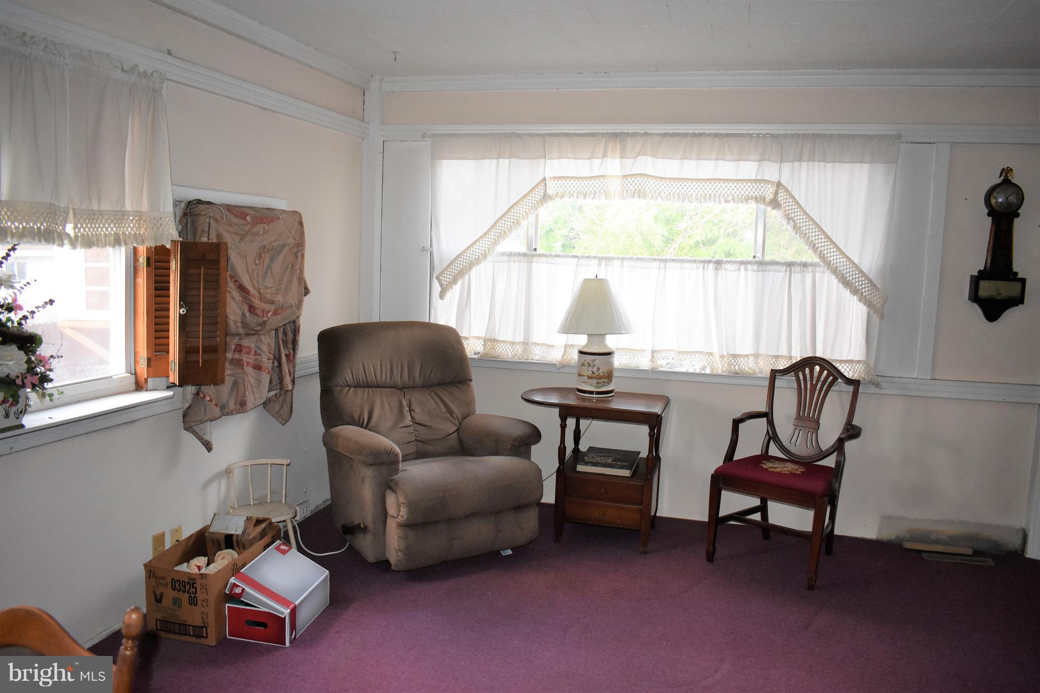1205 3rd Road Baltimore, MD 21220 - Photo 3 of 12 a living room with furniture and a window
