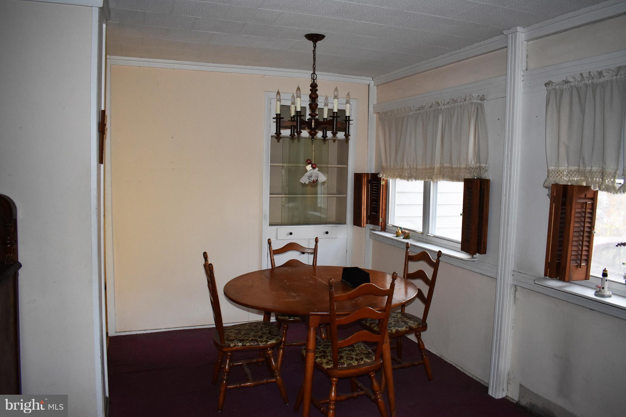 1205 3rd Road Baltimore, MD 21220 - Photo 4 of 12 a dining room with furniture and window