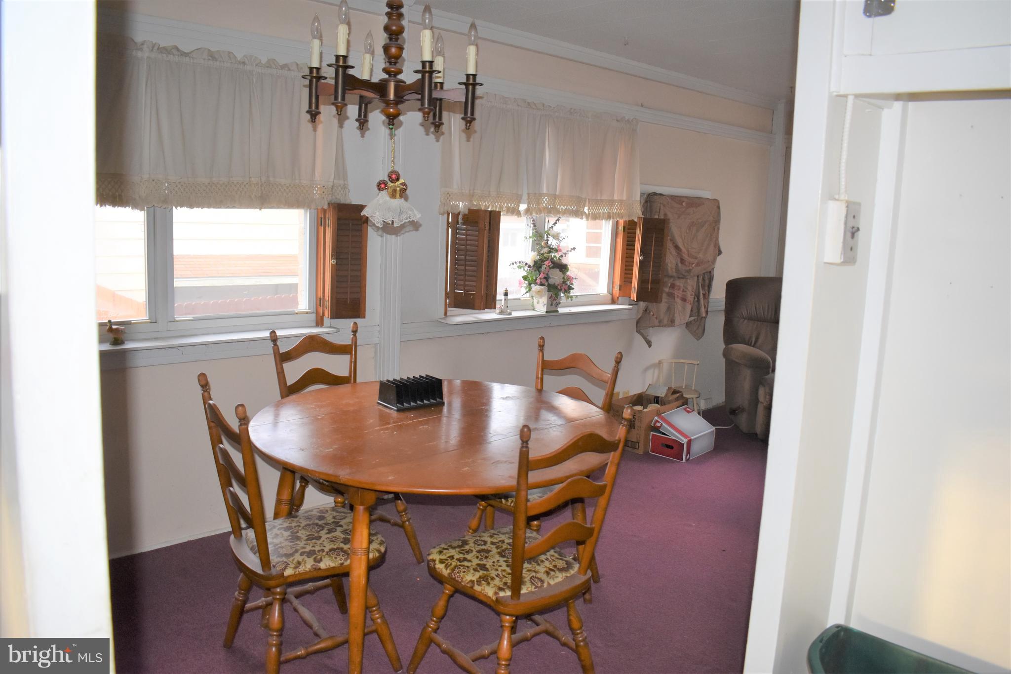 1205 3rd Road Baltimore, MD 21220 - Photo 5 of 12 a dining room with furniture and window