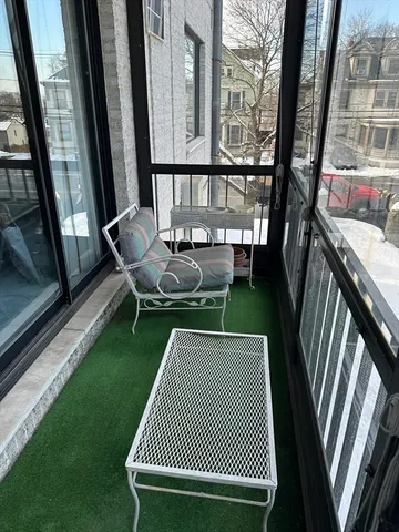 a view of balcony with wooden floor
