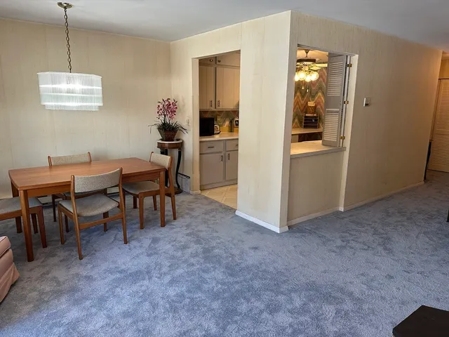 a view of a room with furniture and windows