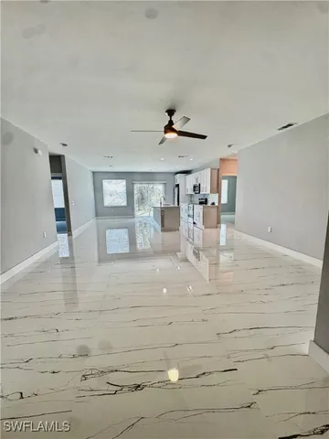 a view of kitchen with wooden floor
