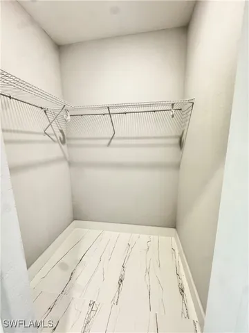 a view of a room with racks on the wall