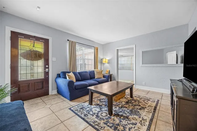 a living room with furniture and a window