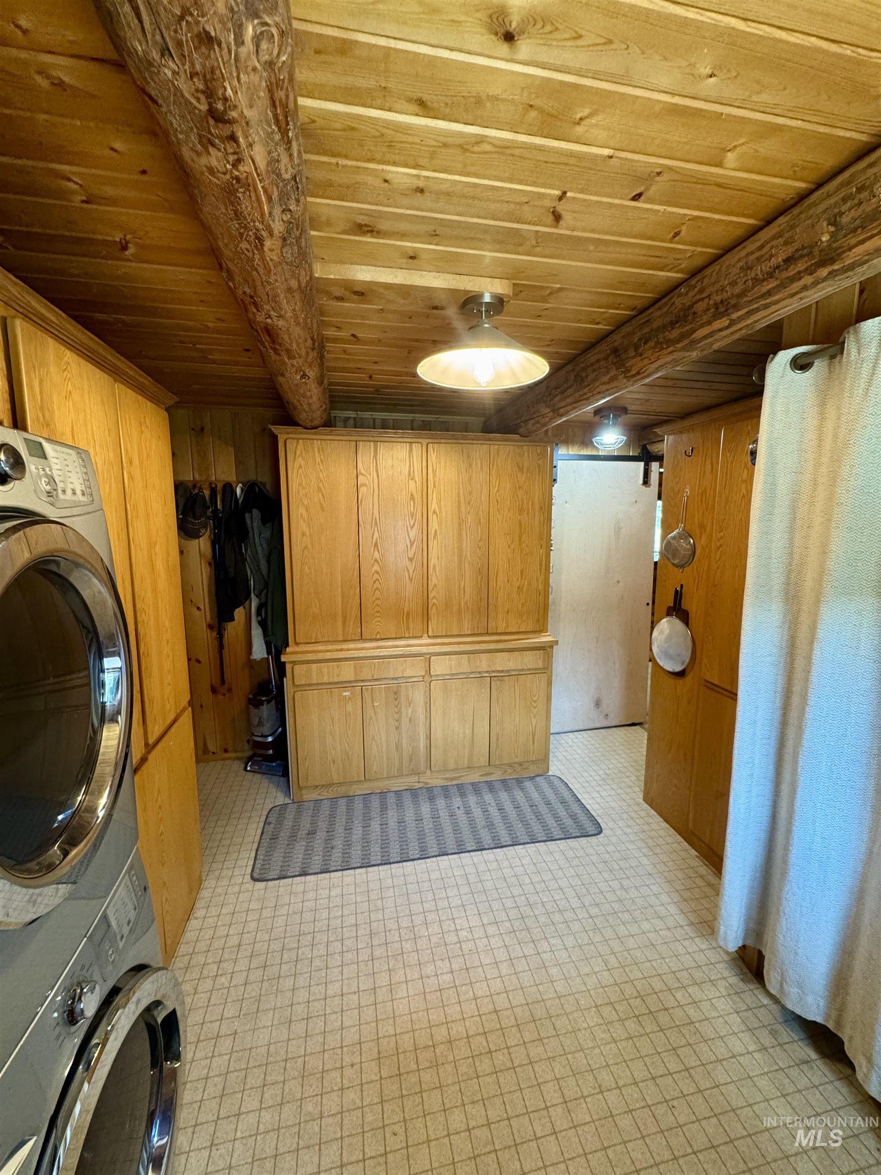 62 Bell Rapids Road Hagerman, ID 83332 - Photo 26 of 34 Wood-paneled ceiling with exposed wood beams, featuring recessed and flush-mount lighting fixtures