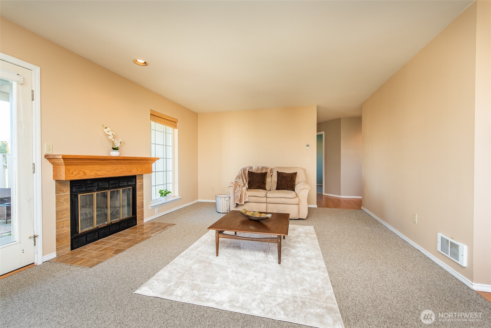 892 North Oxford Way Sequim, WA 98382 - Photo 14 of 38 a living room with furniture a fireplace and a flat screen tv
