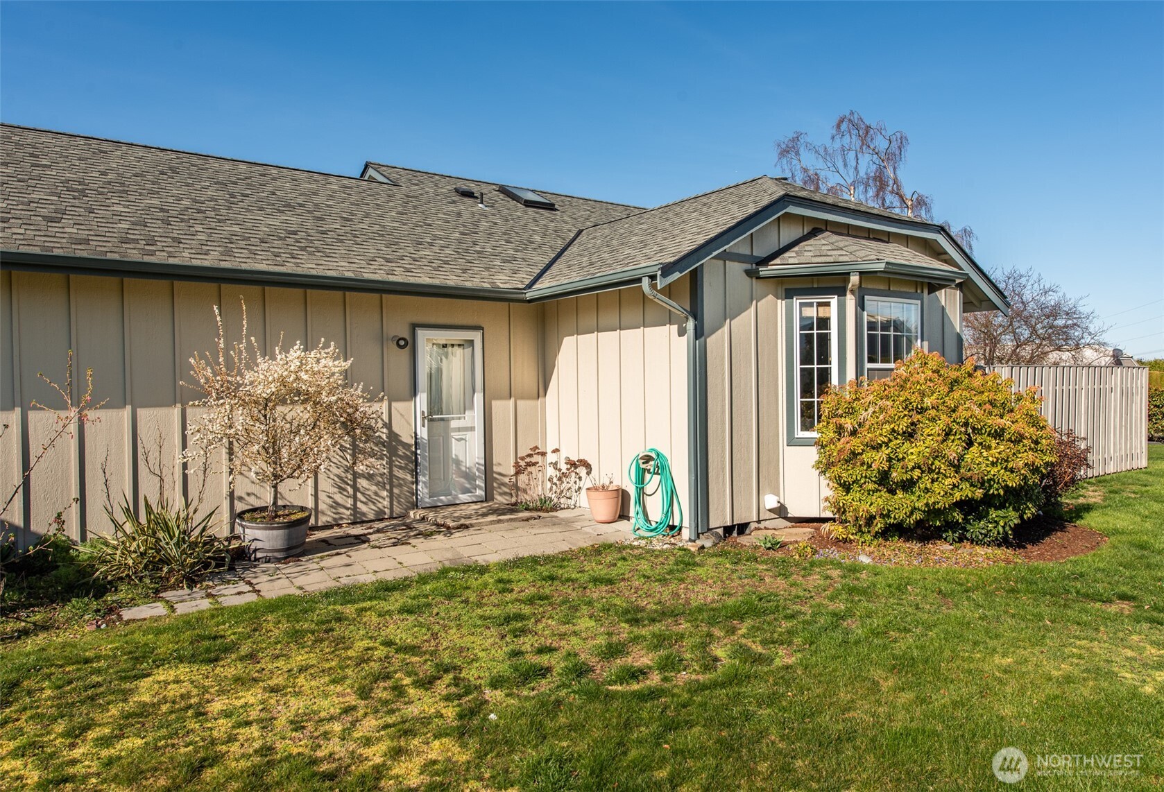 892 North Oxford Way Sequim, WA 98382 - Photo 26 of 38 a front view of a house with garden