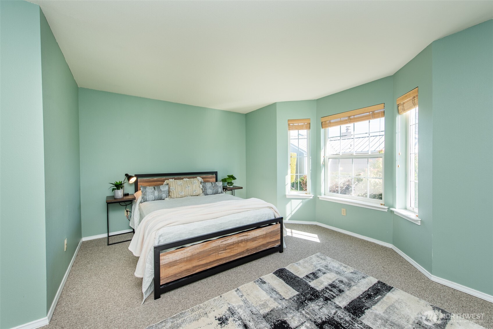 892 North Oxford Way Sequim, WA 98382 - Photo 29 of 38 a bed sitting in a bedroom next to a window