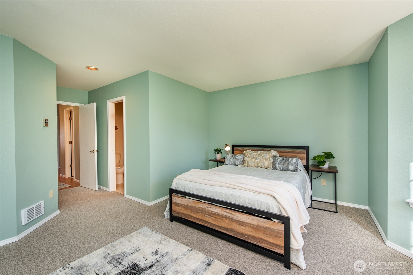 892 North Oxford Way Sequim, WA 98382 - Photo 30 of 38 a bedroom with a bed and a cabinets