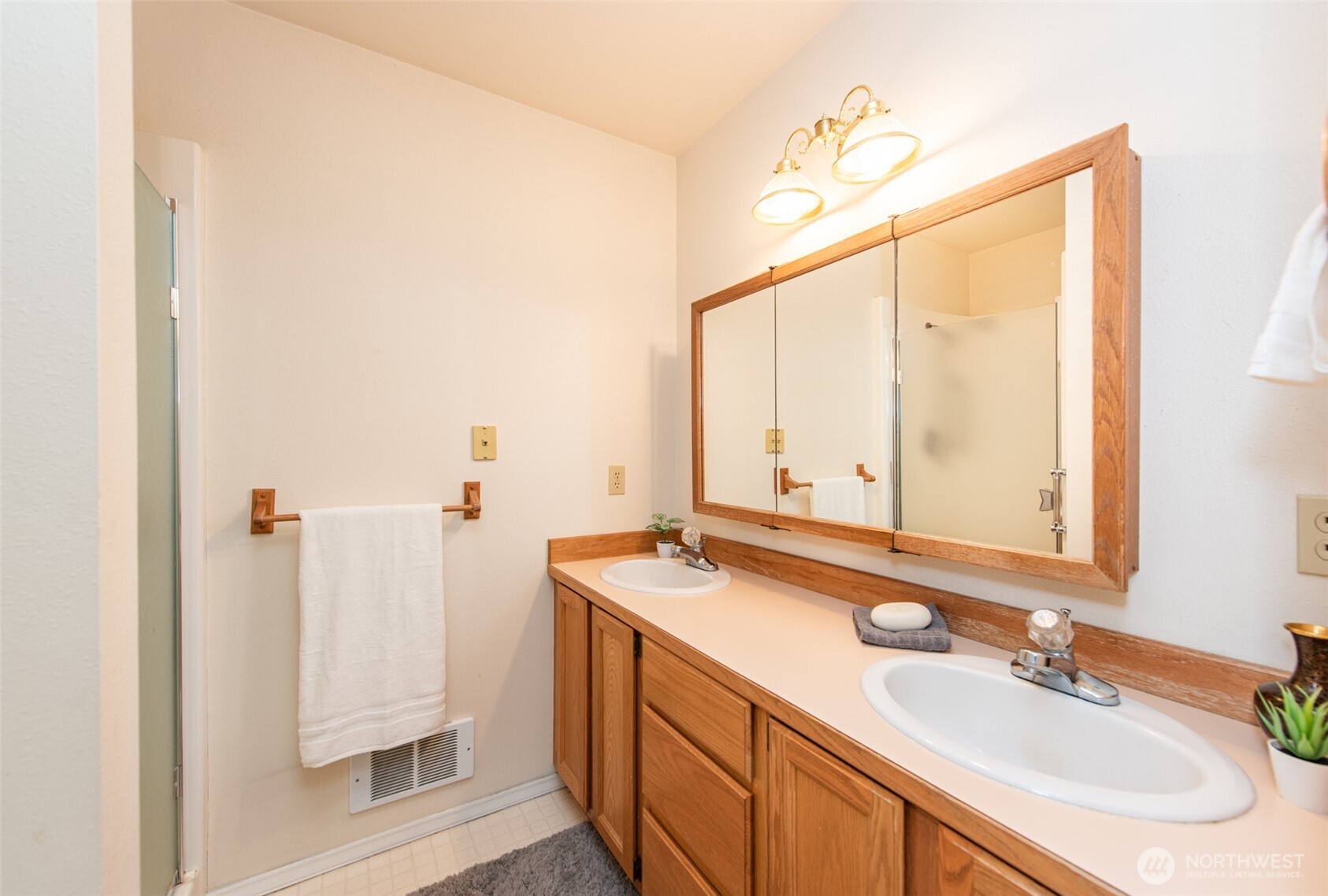 892 North Oxford Way Sequim, WA 98382 - Photo 32 of 38 a bathroom with a sink and a mirror