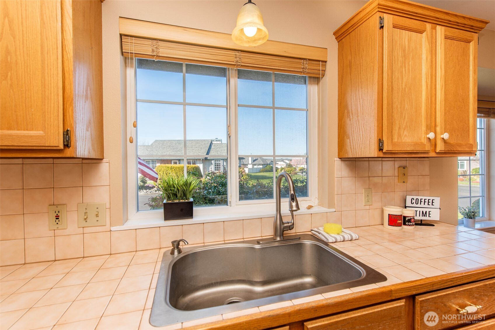 892 North Oxford Way Sequim, WA 98382 - Photo 9 of 38 a sink sitting next to a window