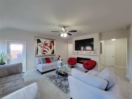 a living room with furniture and a flat screen tv