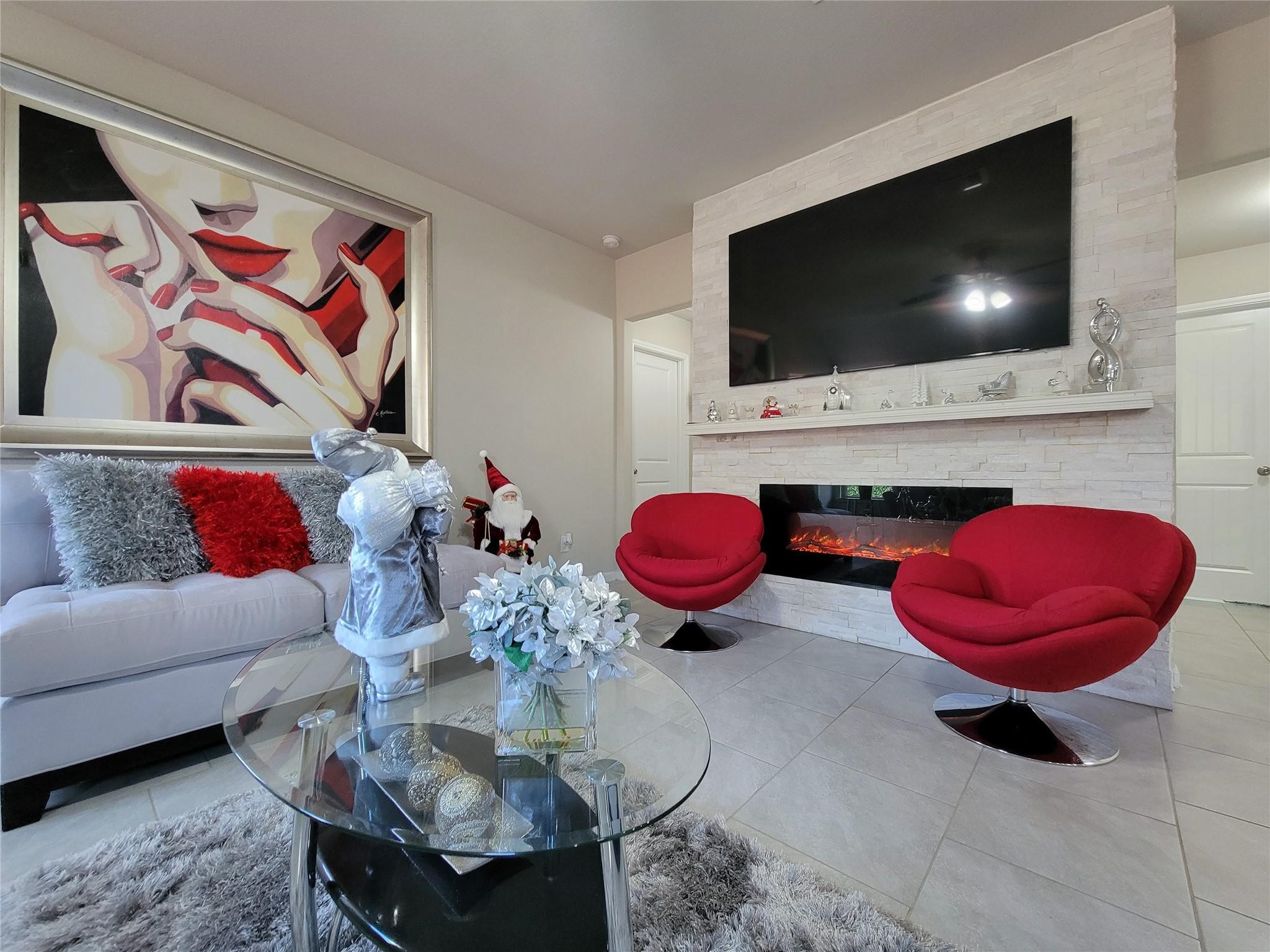 610 Autumn Flats Way Rosharon, TX 77583 - Photo 15 of 29 a living room with furniture and a flat screen tv