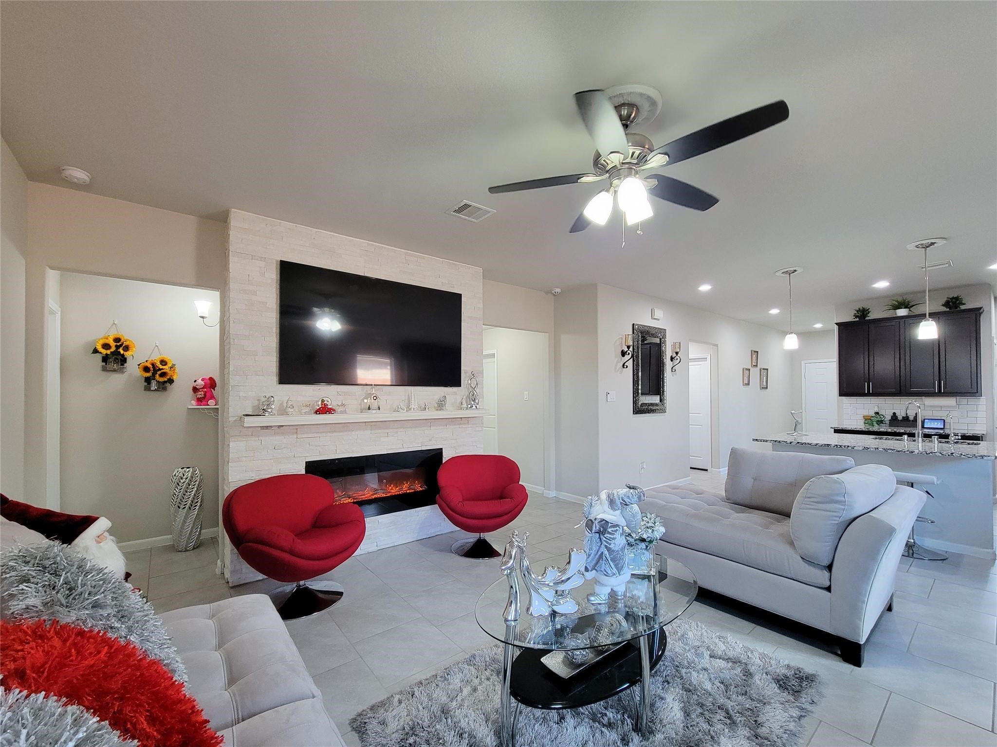 610 Autumn Flats Way Rosharon, TX 77583 - Photo 17 of 29 a living room with furniture and a flat screen tv