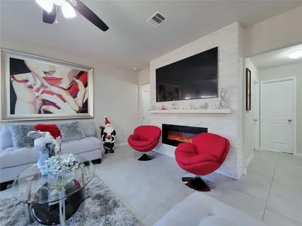 a living room with furniture and a flat screen tv