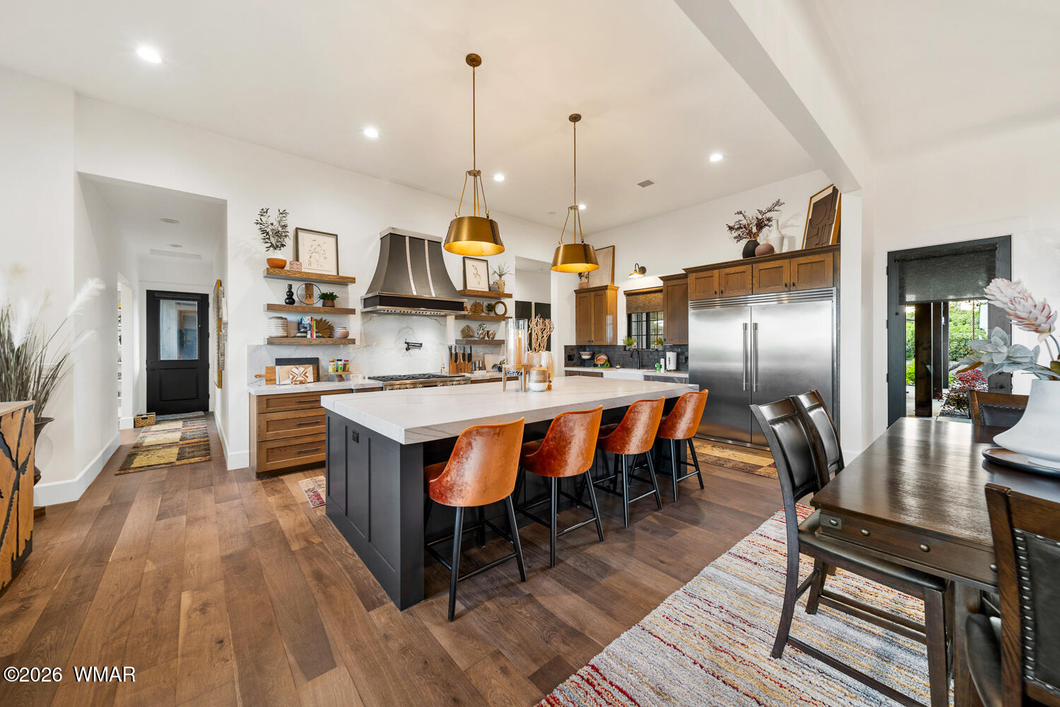 512 Fieldy Road Show Low, AZ 85901 - Photo 24 of 128 a kitchen with stainless steel appliances kitchen island granite countertop a table chairs a sink and a refrigerator