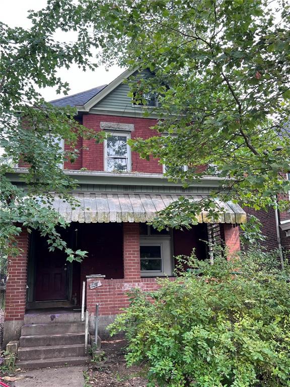 137 Zara Street Pittsburgh, PA 15210 - Photo 1 of 12 a view of a house with a tree and front view