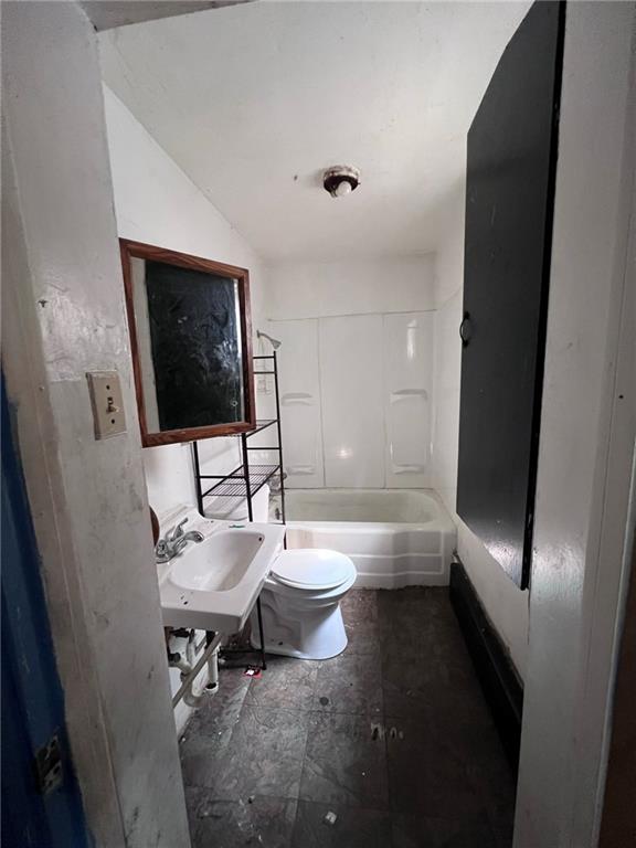 137 Zara Street Pittsburgh, PA 15210 - Photo 4 of 12 a bathroom with a sink a toilet and shower